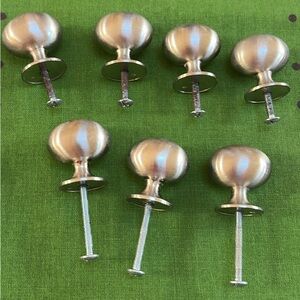 Set of 7 egg- shaped Cabinet Knobs in Brushed Nickel by  Amerock
